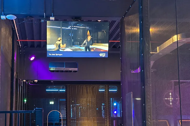 safety video loop on a spinetix digital signage display in front of trampoline room